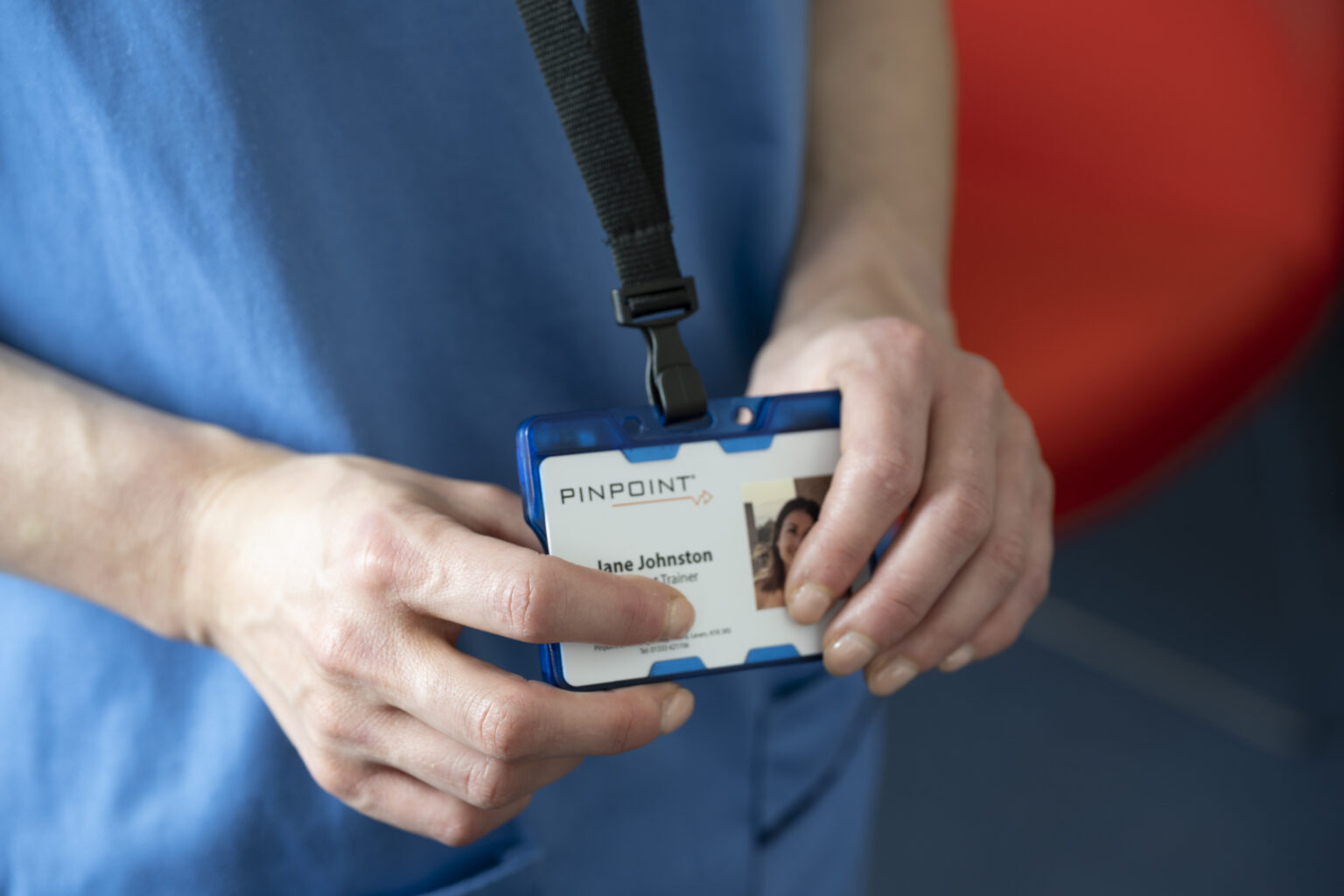 Nurse holds Pinpoint Badge PIT in hands