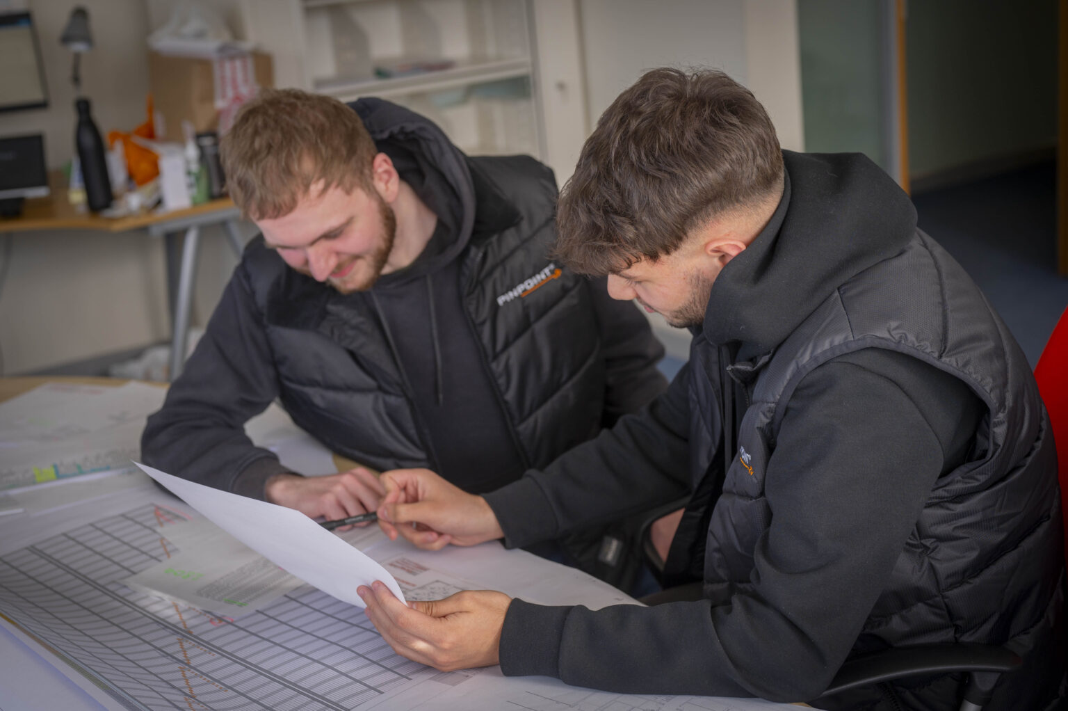 Pinpoint engineers review specification documents.