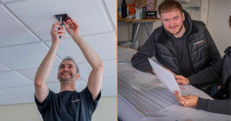 A man on the left installing a Pinpoint system on the ceiling and a man on the right smiling at the camera.